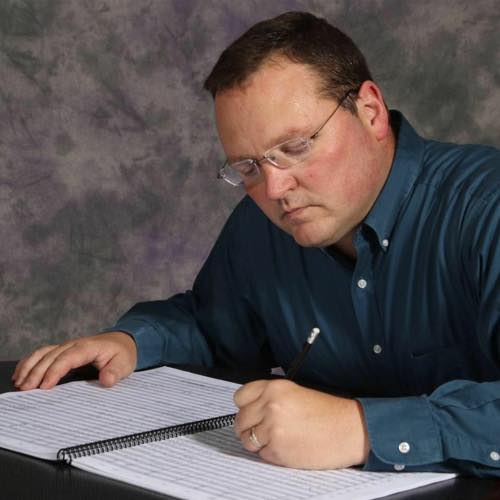Dr. Rose composing at his desk